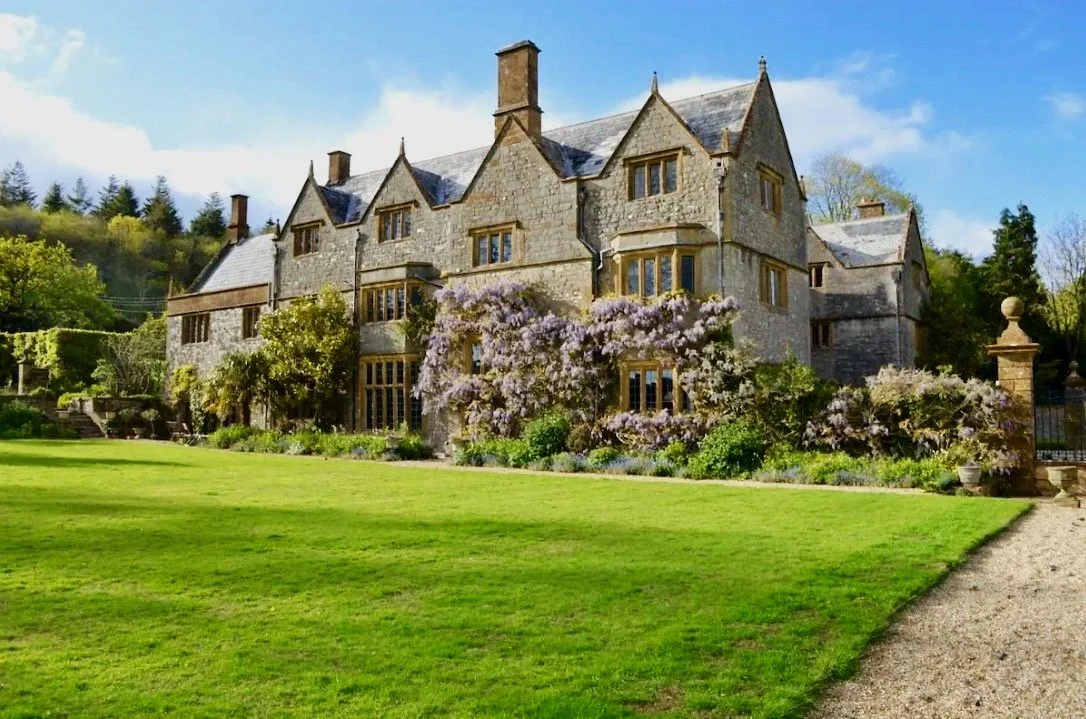 The golden stone facade of the historic Somerset country house that hosts the retreat